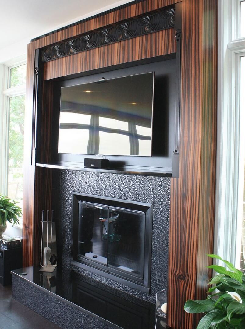 Designed by architect Barbara Corwin and engineered by Wood Join Co, this macassar ebony fireplace features beautiful ebony grain and black accents.